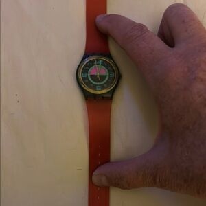 Red and green vintage swatch watch